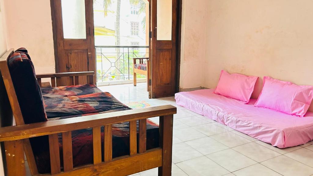 Postel nebo postele na pokoji v ubytování Muffys Apartment