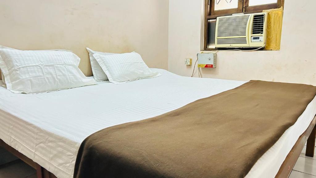 Postel nebo postele na pokoji v ubytování Muffys Apartment