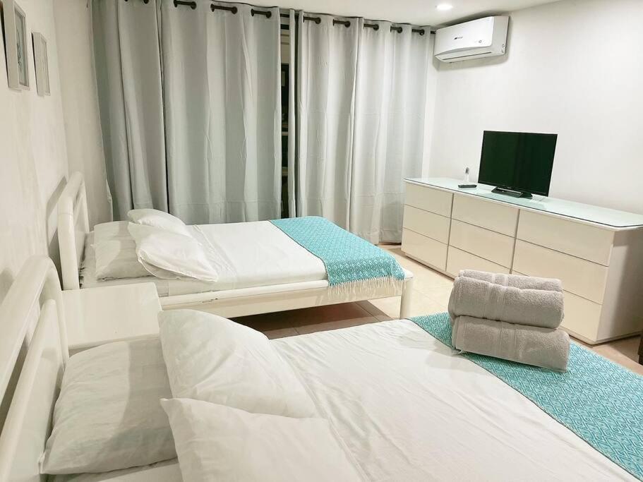 Postel nebo postele na pokoji v ubytování Espectaculares Aptos Hansa Coral San Andres Islas