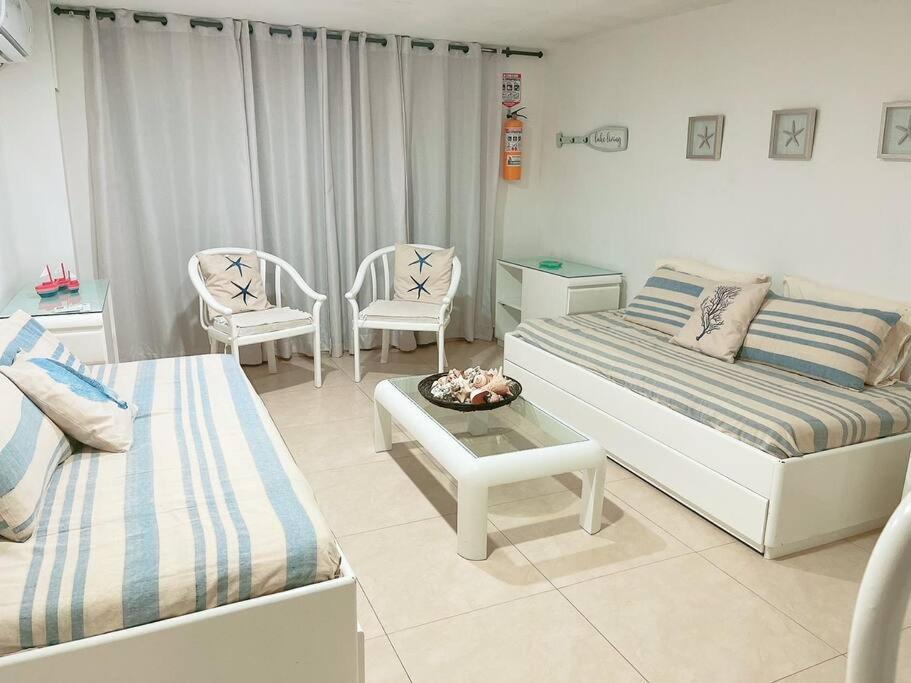 Postel nebo postele na pokoji v ubytování Espectaculares Aptos Hansa Coral San Andres Islas