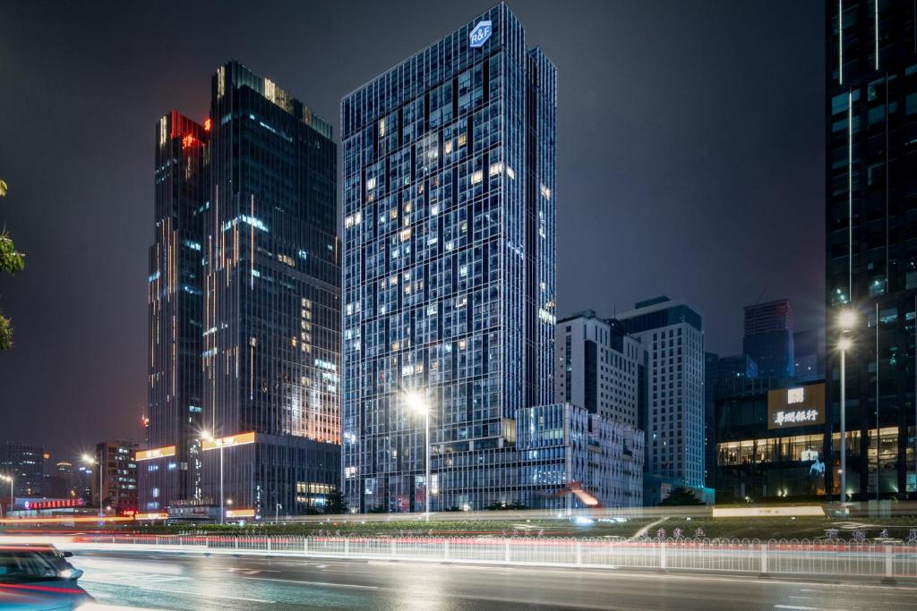a city lit up at night with tall buildings at Orange Tree International Hotel Zhujiang New Town US Consulate General Guangzhou Branch - Free Shuttle Bus to Canton Fair Complex During Canton Fair Period in Guangzhou