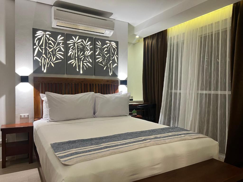 Postel nebo postele na pokoji v ubytování Aira Boracay Hotel