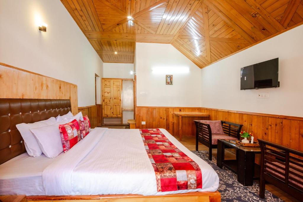 Postel nebo postele na pokoji v ubytování Tripli Hotels Conifer Wood Cottage