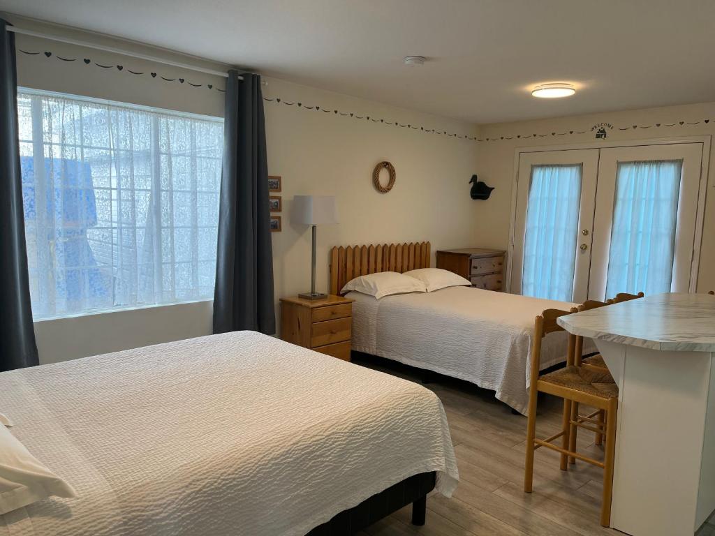 Postel nebo postele na pokoji v ubytování Empire Motel