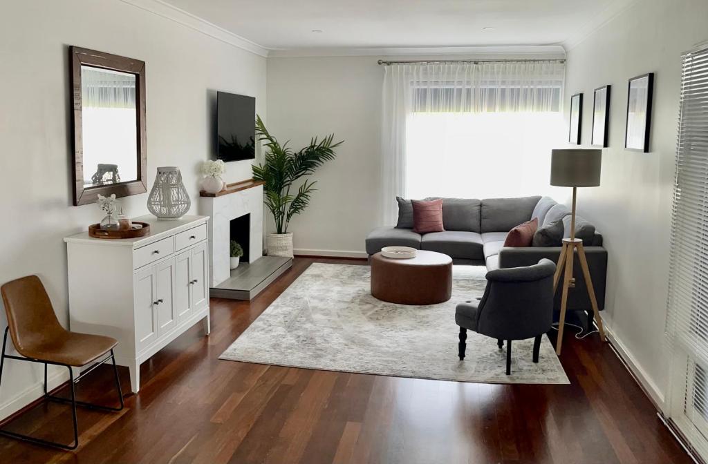 a living room with a couch and a table at The Parkview Retreat in Rockingham