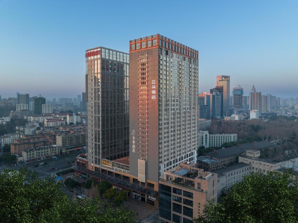 a view of two tall buildings in a city at Atour Hotel Hefei Changjiang Road in Hefei