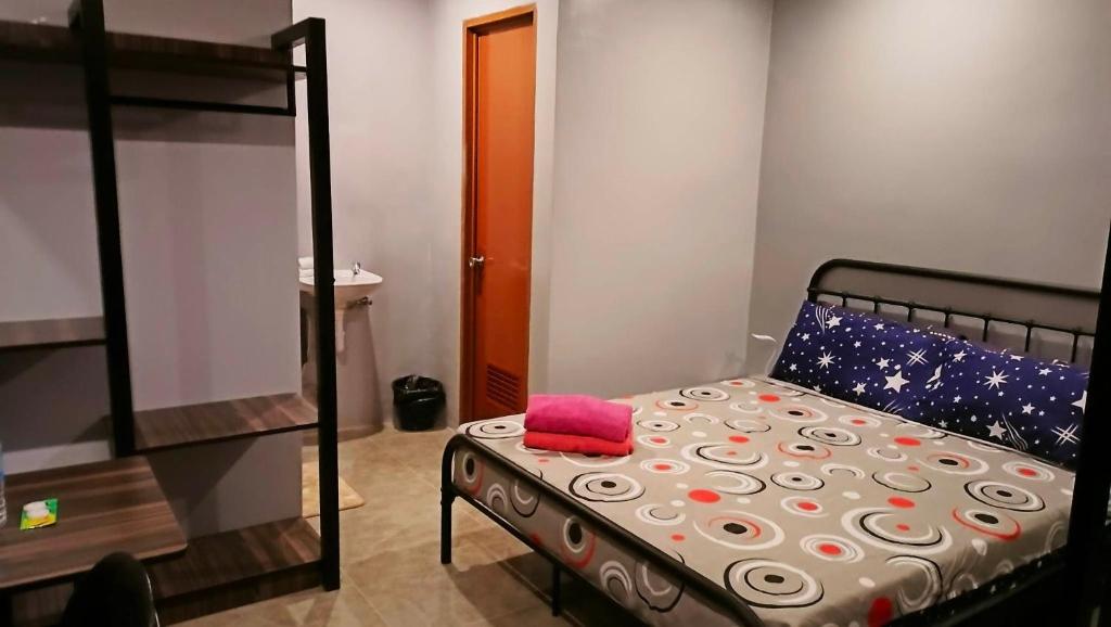 Postel nebo postele na pokoji v ubytování KM Pension