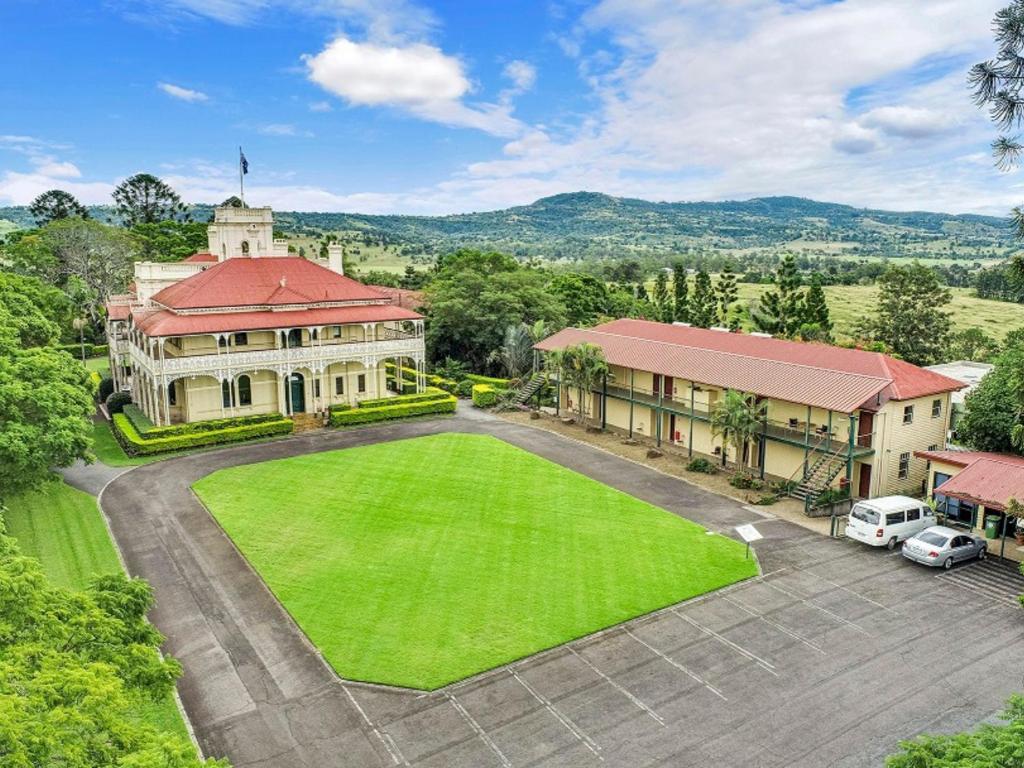 an aerial view of a mansion with a large yard at Woodlands of Marburg in Marburg