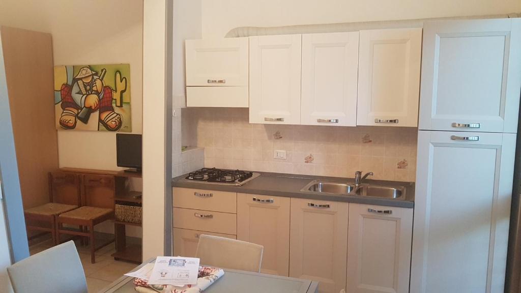 Kuchyň nebo kuchyňský kout v ubytování Villa Gardenia