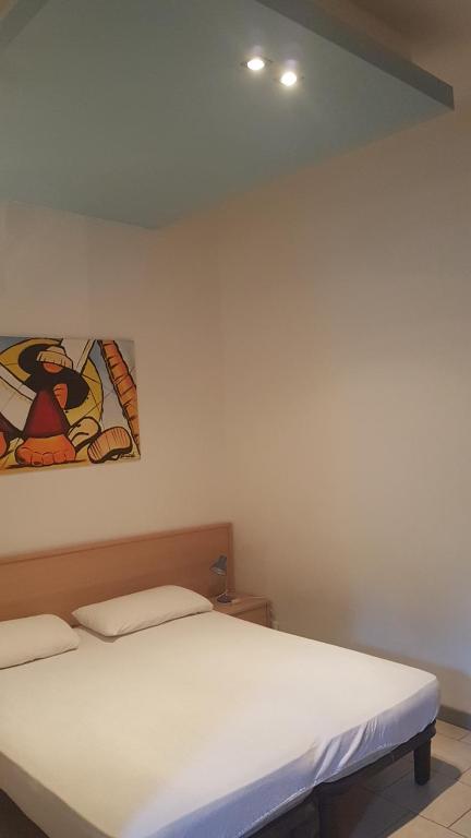 Postel nebo postele na pokoji v ubytování Villa Gardenia