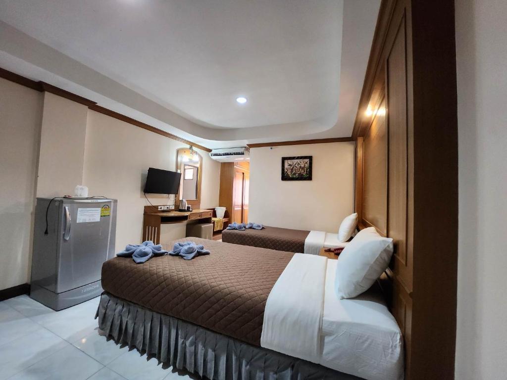 Postel nebo postele na pokoji v ubytování White Rose​ Hotel​ II​