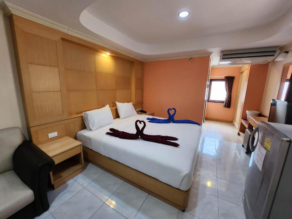 Postel nebo postele na pokoji v ubytování White Rose​ Hotel​ II​