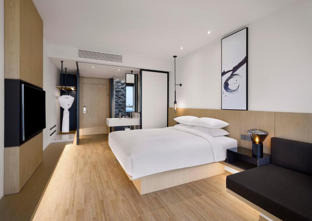Postel nebo postele na pokoji v ubytování Fairfield by Marriott Busan Songdo Beach