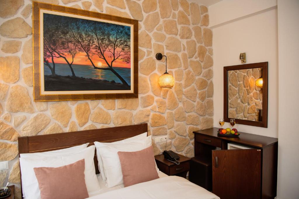 Postel nebo postele na pokoji v ubytování Hotel Agelis