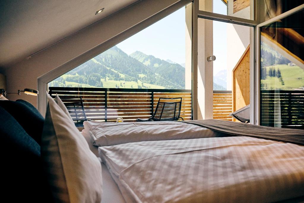 Krevet ili kreveti u jedinici u okviru objekta Genuss- & Aktivhotel Sonnenburg