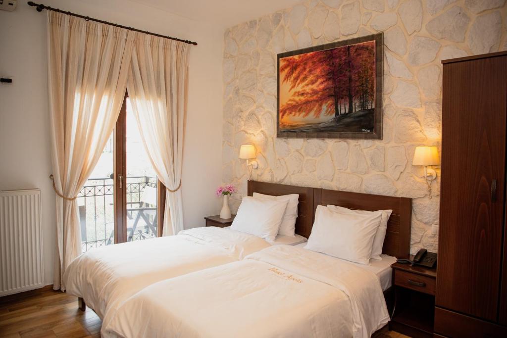 Postel nebo postele na pokoji v ubytování Hotel Agelis