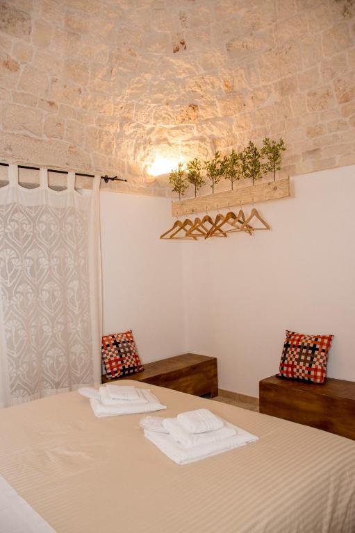 Postel nebo postele na pokoji v ubytování Pavì Trulli e Suites