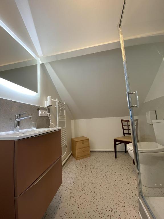 a bathroom with a sink and a toilet at Hotel et Studios Le Marina Baie de La Baule in Pornichet