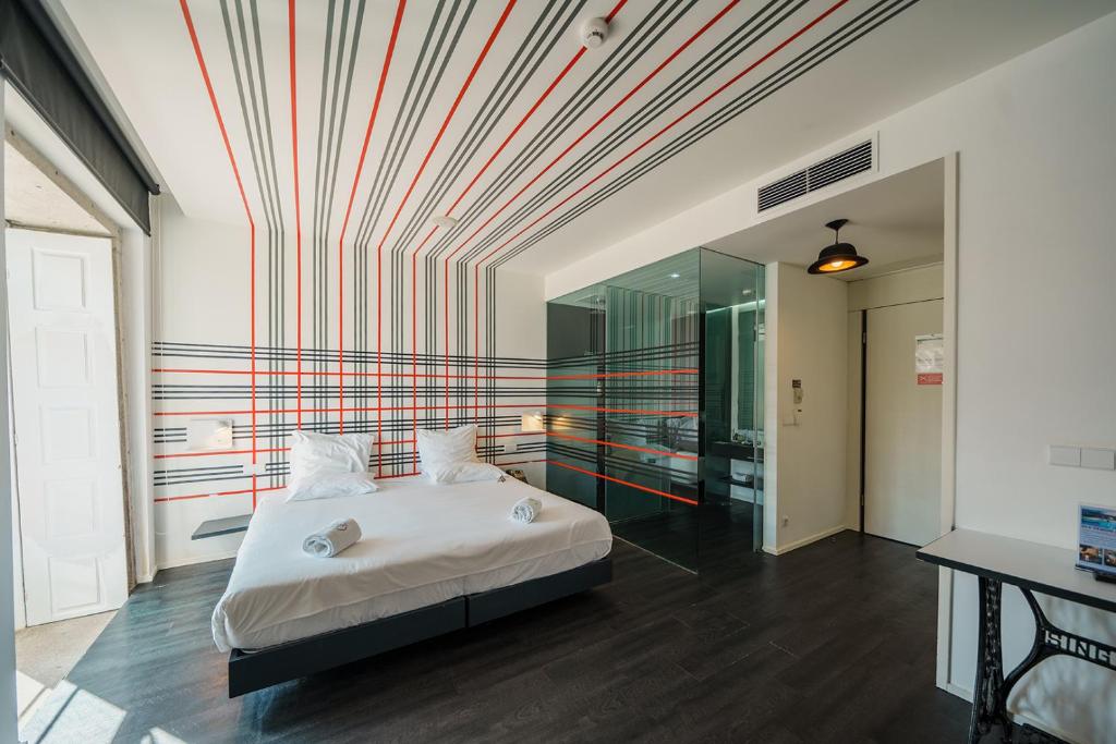 Postel nebo postele na pokoji v ubytování Design & Wine Hotel
