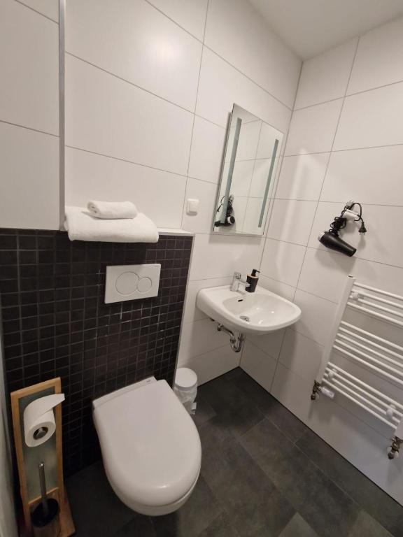 Koupelna v ubytování Das SP Hotel