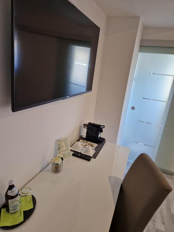 TV a/nebo společenská místnost v ubytování Das SP Hotel