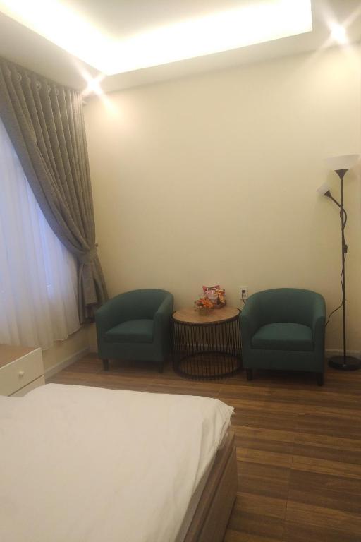 Postel nebo postele na pokoji v ubytování Homeland Hotel