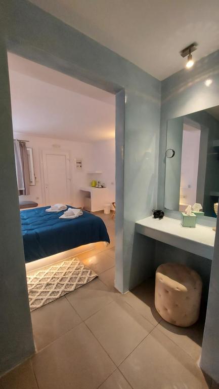 Postel nebo postele na pokoji v ubytování Ambience Suites