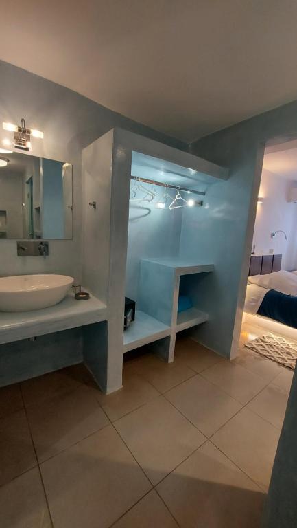 Postel nebo postele na pokoji v ubytování Ambience Suites