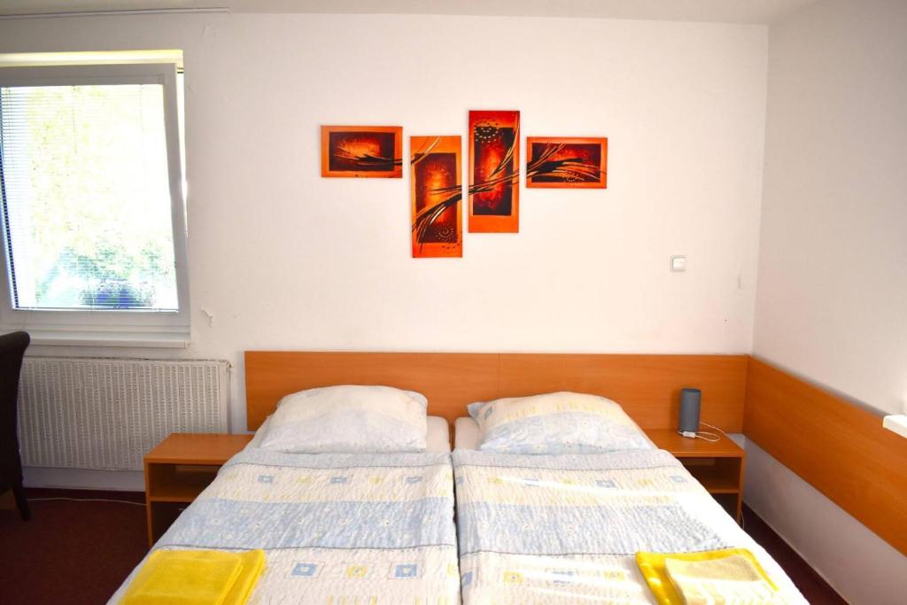 Postel nebo postele na pokoji v ubytování Penzion Era