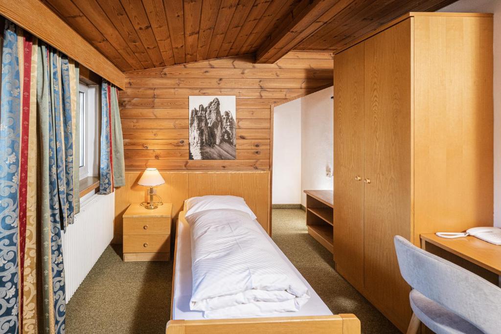 Postel nebo postele na pokoji v ubytování Hotel Waldheim