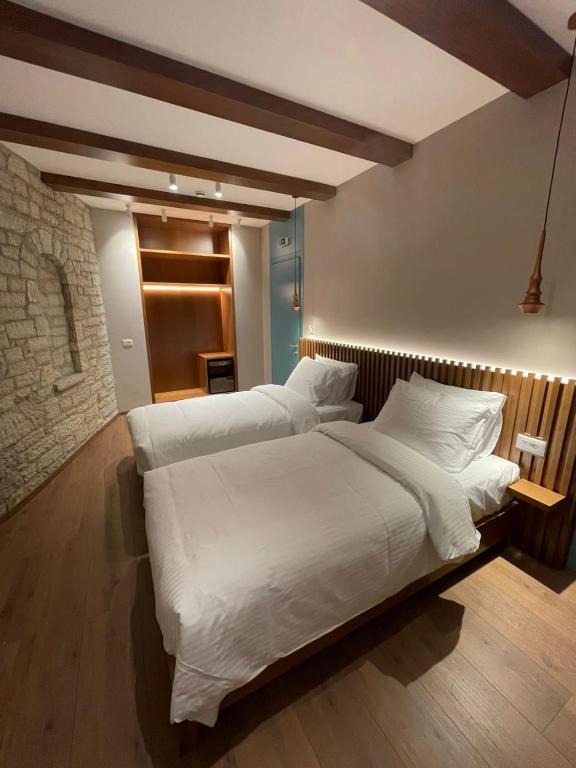 Postelja oz. postelje v sobi nastanitve Palorto Hotel