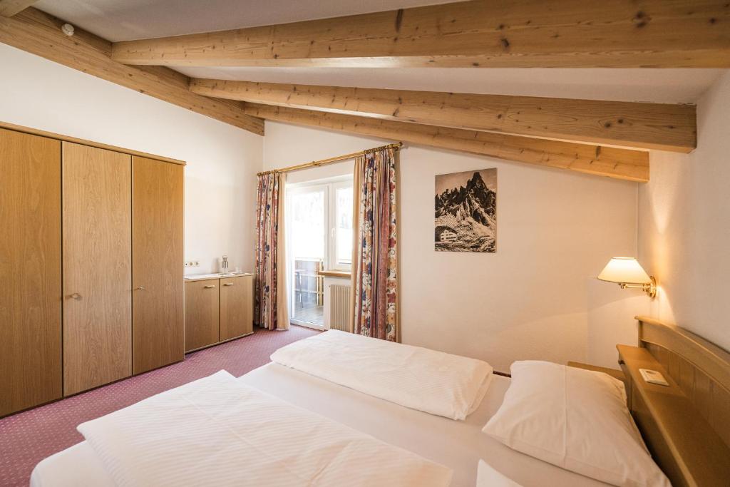 Postel nebo postele na pokoji v ubytování Hotel Waldheim