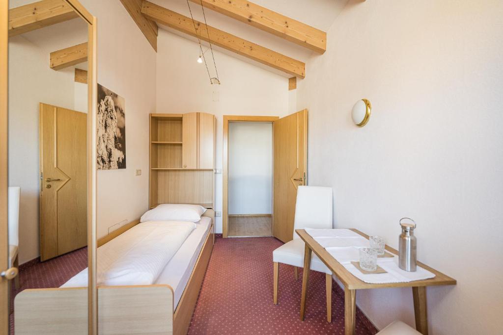 Postel nebo postele na pokoji v ubytování Hotel Waldheim