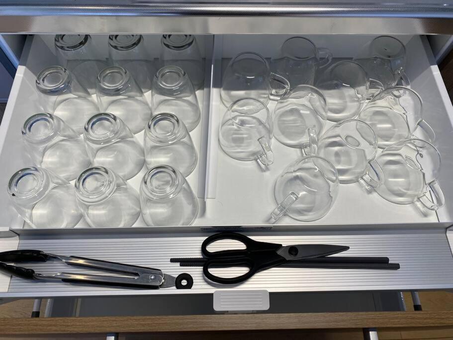 a drawer with a pair of scissors and glasses at FTH Moon Light 3min to Sta. in Shimo-yoshida