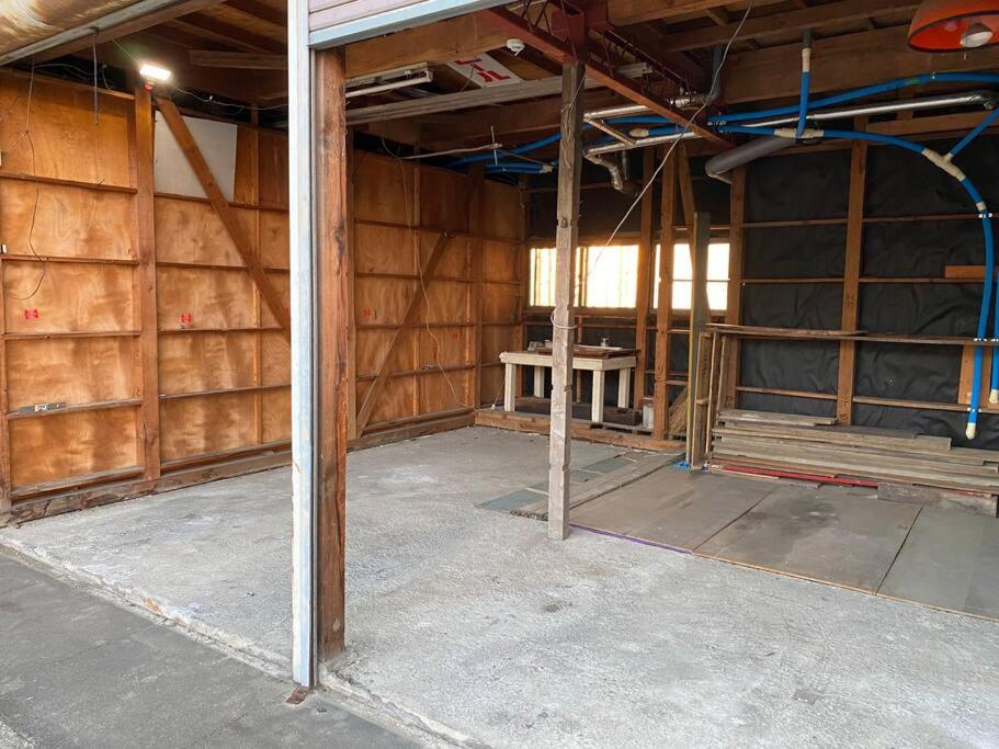 an unfinished room with a table in the middle at FTH Moon Light 3min to Sta. in Shimo-yoshida