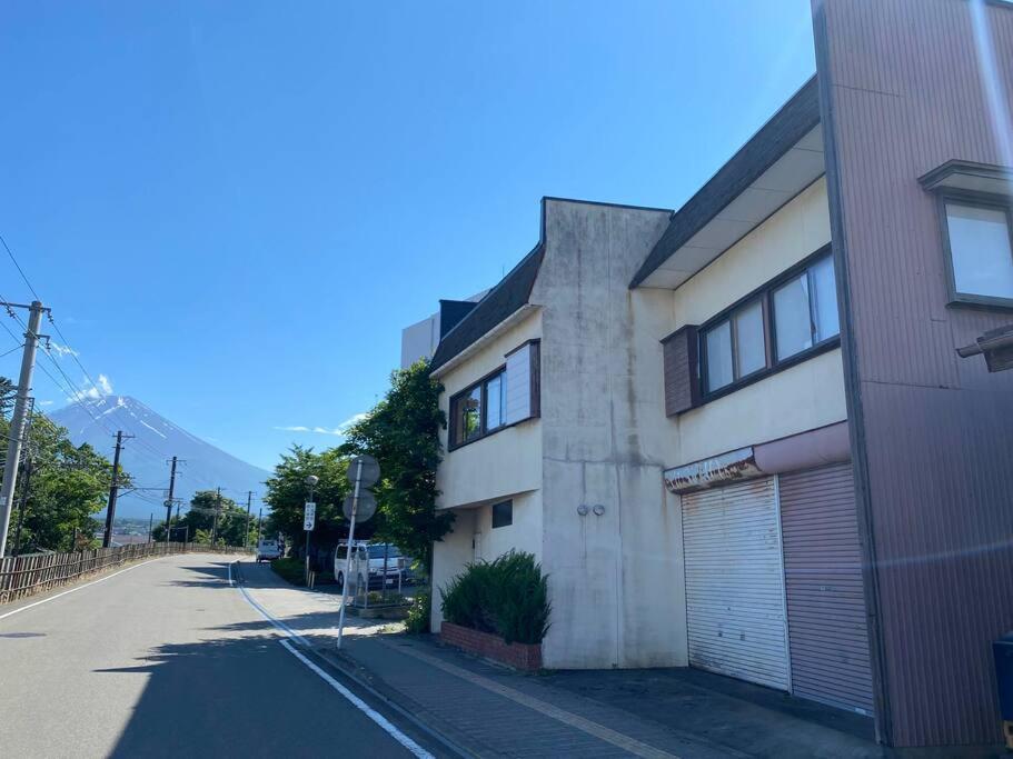 a building on the side of a street at FTH Moon Light 3min to Sta. in Shimo-yoshida
