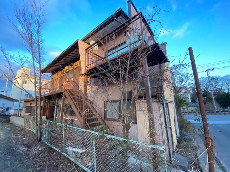 a house being constructed with a fence around it at FTH Moon Light 3min to Sta. in Shimo-yoshida