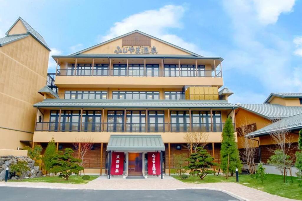 a large building with a sign on it at FTH Moon Light 3min to Sta. in Shimo-yoshida