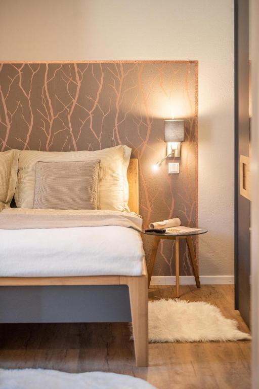Postel nebo postele na pokoji v ubytování Appartements am Landschaweg