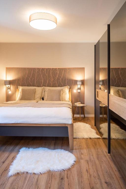 Postel nebo postele na pokoji v ubytování Appartements am Landschaweg