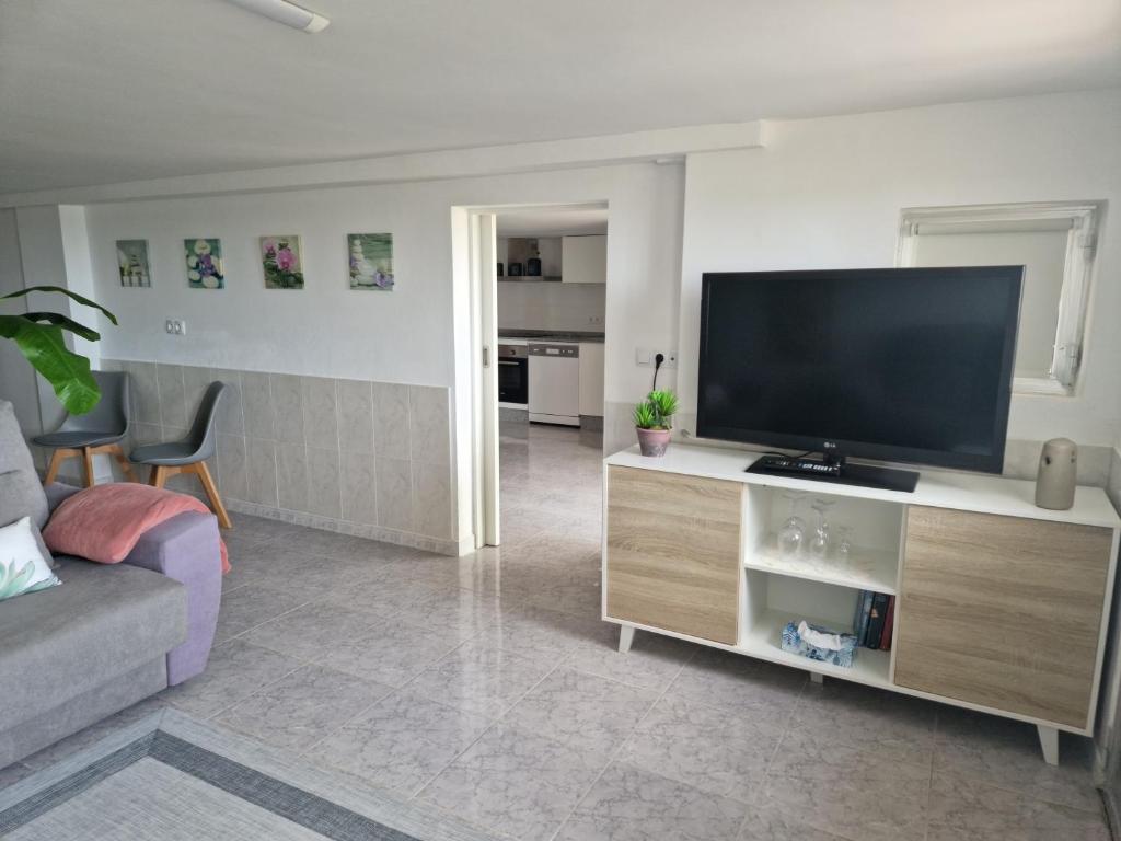 TV a/nebo společenská místnost v ubytování CASA MAR DA LAXE