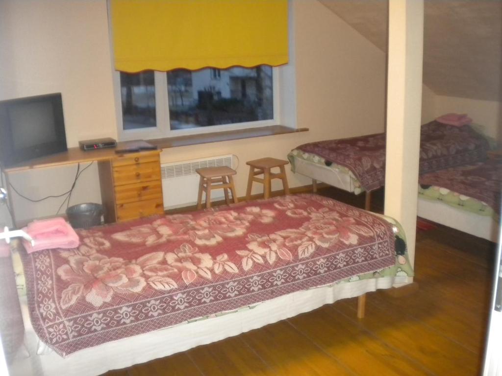 Postel nebo postele na pokoji v ubytování Madise Guesthouse