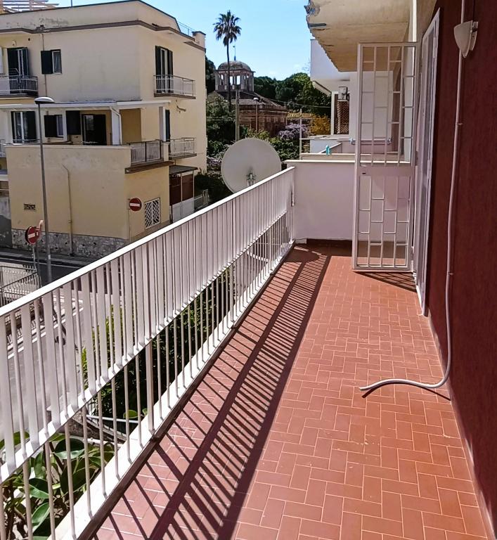 a balcony of a house with a white railing at Casa Vacanze AlbA in Bari