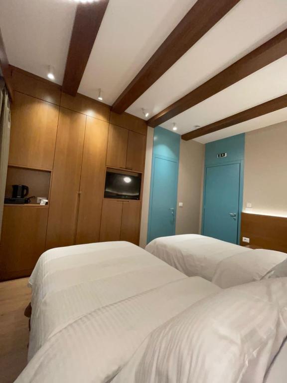 Postelja oz. postelje v sobi nastanitve Palorto Hotel
