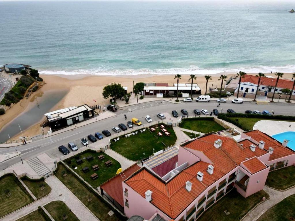 an aerial view of a building next to the beach at Cantinho da Sara in Portimão