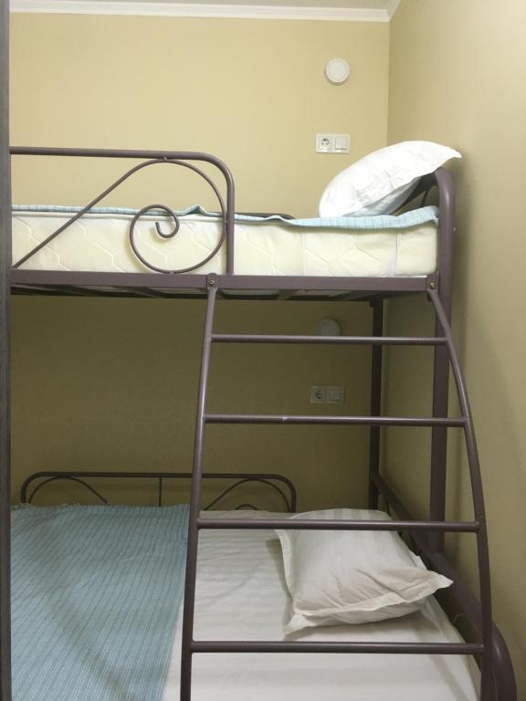 a couple of bunk beds in a room at Hostel 5 Сapsule - rooms in Ustʼ-Kamenogorsk