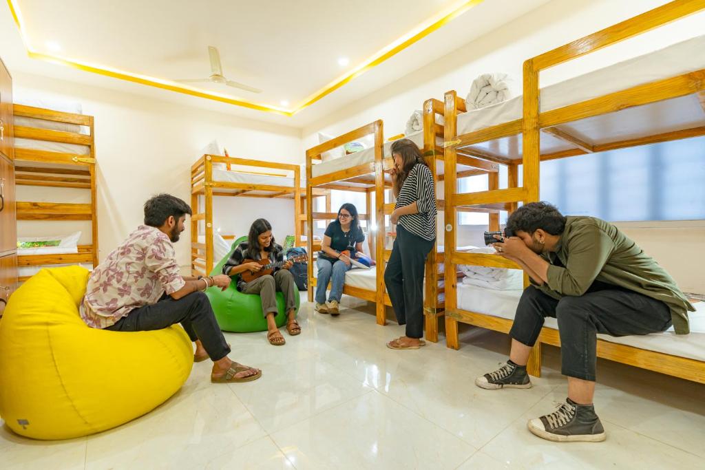 a group of people in a room with bunk beds at ArtBuzz Jaipur in Jaipur