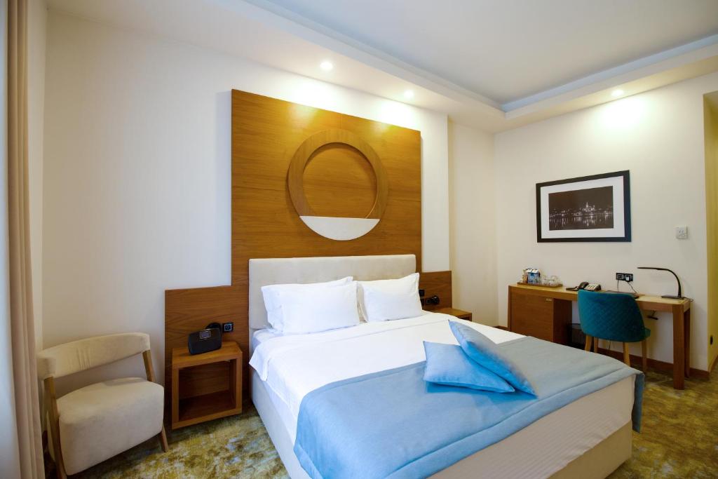 Postel nebo postele na pokoji v ubytování Hotel City Savoy