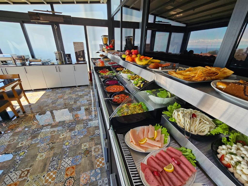 a buffet line with many different types of food at Anthemis Hotel in Istanbul