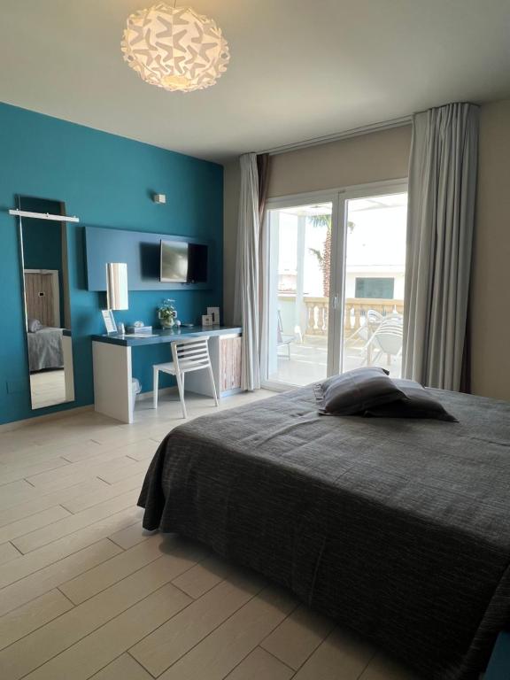 Postel nebo postele na pokoji v ubytování Tabù Hotel
